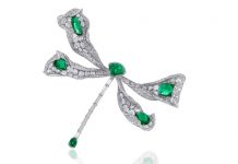 Dragonfly brooch in 18-karat white gold embellished with emeralds and diamonds