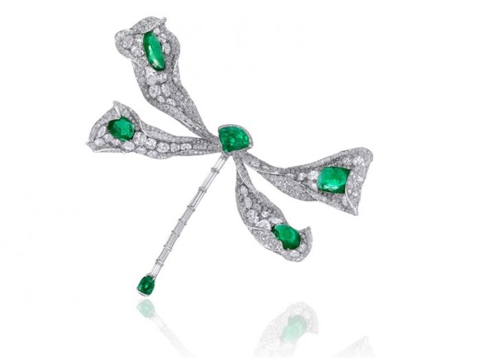 Dragonfly brooch in 18-karat white gold embellished with emeralds and diamonds