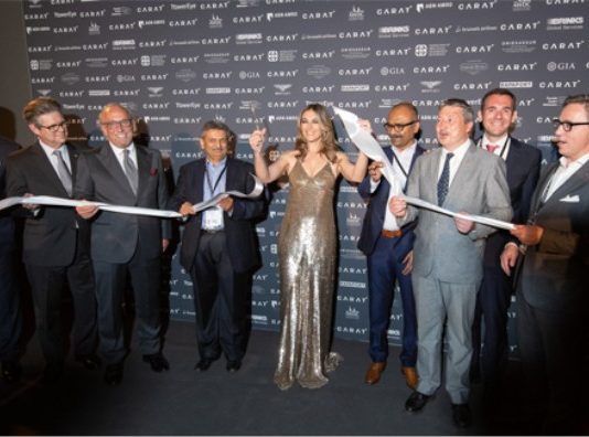 Elizabeth Hurley cuts the ceremonial ribbon to officially open CARAT+ 2018.