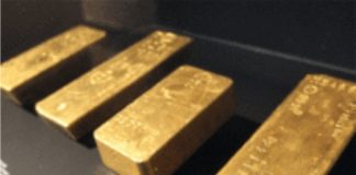 Gold prices subdued as dollar extends rally