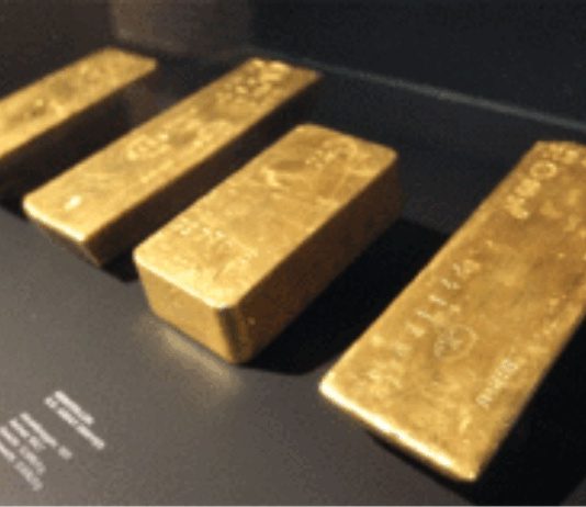 Gold prices subdued as dollar extends rally
