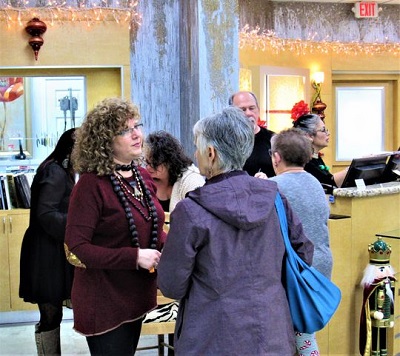 Uri Freijanes, left, welcomes customers to the new store