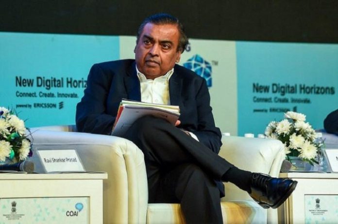 India's richest man to battle Amazon, Walmart in e-commerce