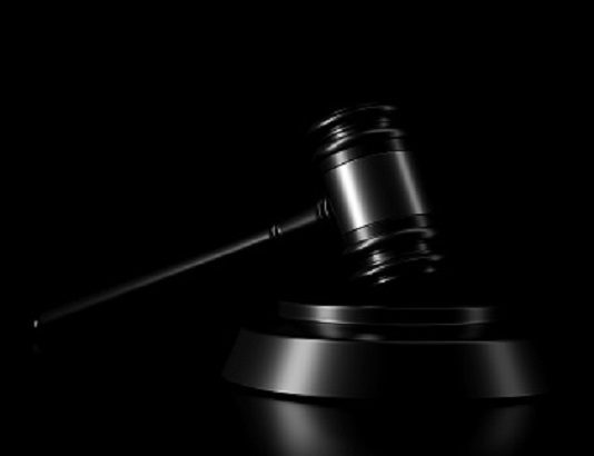Light and shadow of gavel in the darkness. 3D rendering.