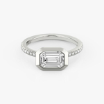 The Signature Bezel Ring in Platinum (Featuring an Emerald Cut Stone and Pavé Band)