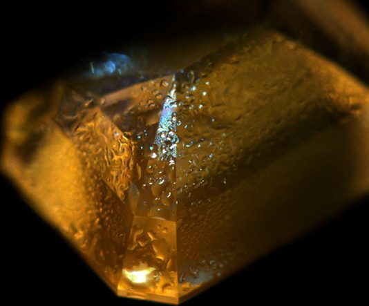 Orange Phosphorescence Hints at Lab Grown Defect