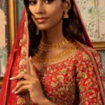 In a festive mood, a model wearing exquisite gold jewellery by Damas